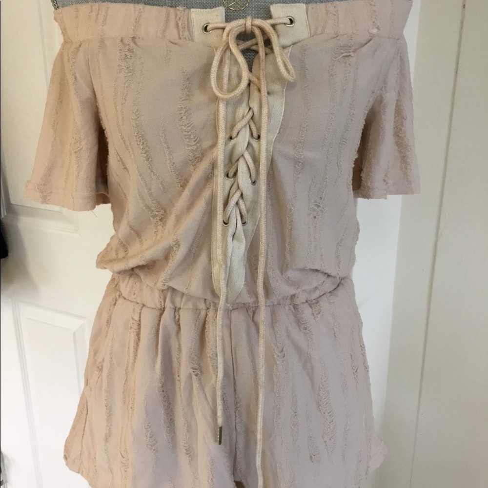 Fun & flirty off the shoulder short romper.